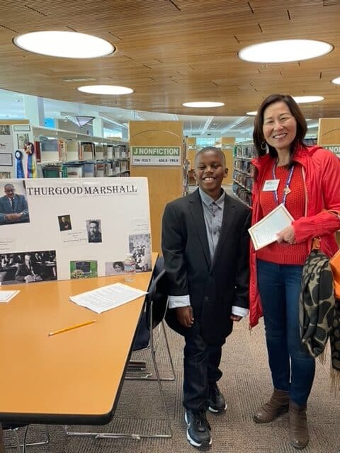 Rosa in library with student