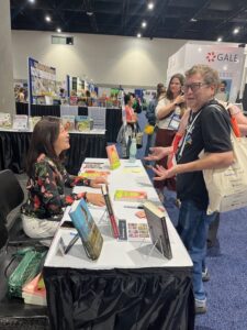 Rosa signing books at the June 2024 ALA Convention in San Diego