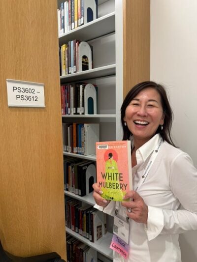 Rosa at the Smith Library finding a copy of her book 