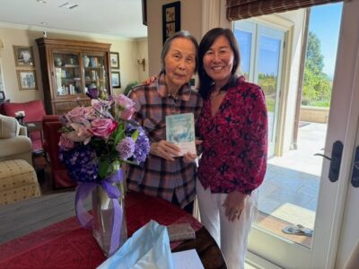 Rosa Kwon Easton and her mother, holding a copy of White Mulberry, Korean edition.
