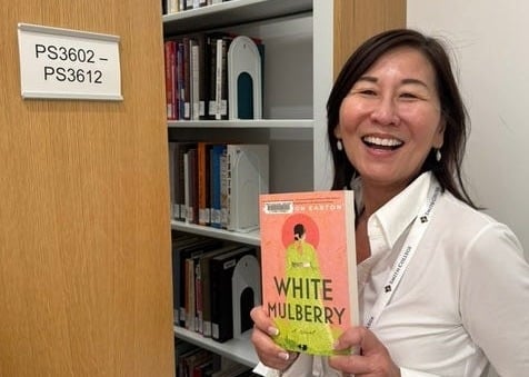 Rosa in the stacks at Smith Library